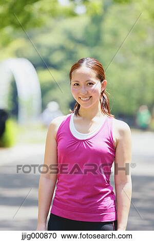 Young Japanese girl in fitness clothes in the park View Large Photo Image Stock Image - Young Japanese girl in fitness clothes in the park. Fotosearch
