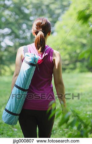 Young Japanese girl in fitness clothes in the park View Large Photo Image Stock Photo - Young Japanese girl in fitness clothes in the park. Fotosearch
