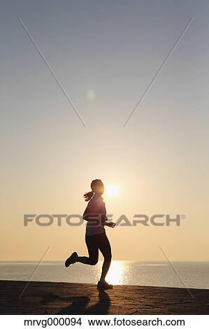 Young Japanese girl jogging View Large Photo Image Picture - Young Japanese girl jogging. Fotosearch