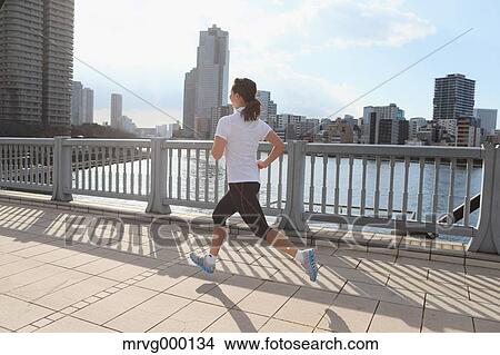 Young Japanese girl jogging View Large Photo Image Picture - Young Japanese girl jogging. Fotosearch