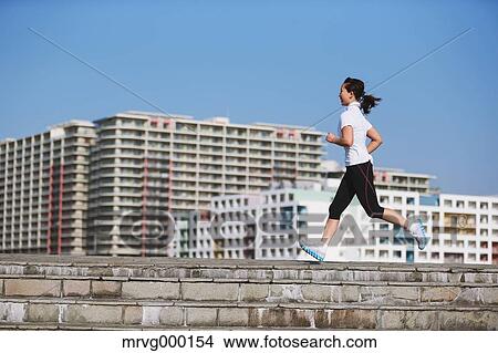 Young Japanese girl jogging View Large Photo Image Picture - Young Japanese girl jogging. Fotosearch