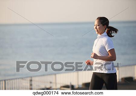 Young Japanese girl jogging View Large Photo Image Picture - Young Japanese girl jogging. Fotosearch