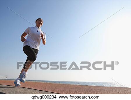 Young Japanese girl jogging View Large Photo Image Picture - Young Japanese girl jogging. Fotosearch