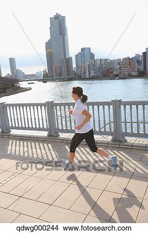 Young Japanese girl jogging View Large Photo Image Picture - Young Japanese girl jogging. Fotosearch