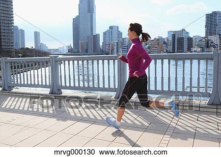 Young Japanese girl jogging View Large Photo Image Stock Image - Young Japanese girl jogging. Fotosearch