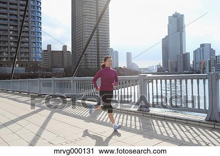 Young Japanese girl jogging View Large Photo Image Stock Image - Young Japanese girl jogging. Fotosearch