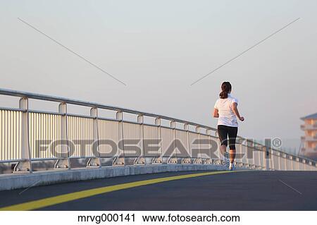 Young Japanese girl jogging View Large Photo Image Stock Image - Young Japanese girl jogging. Fotosearch
