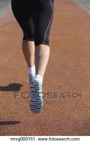 Stock Image - Young Japanese girl jogging. Fotosearch