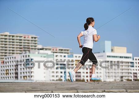 Young Japanese girl jogging View Large Photo Image Stock Image - Young Japanese girl jogging. Fotosearch