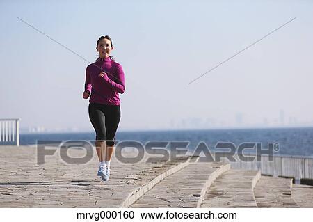 Young Japanese girl jogging View Large Photo Image Stock Image - Young Japanese girl jogging. Fotosearch