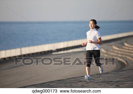 Young Japanese girl jogging View Large Photo Image Stock Image - Young Japanese girl jogging. Fotosearch