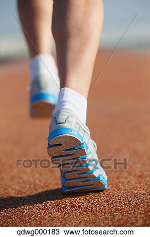 Stock Image - Young Japanese girl jogging. Fotosearch