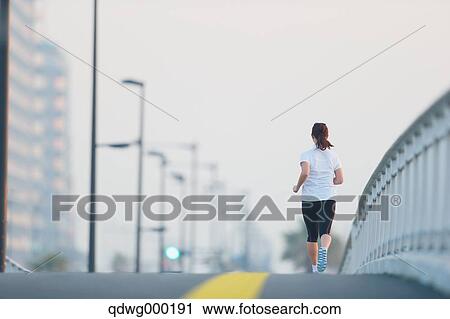 Young Japanese girl jogging View Large Photo Image Stock Image - Young Japanese girl jogging. Fotosearch