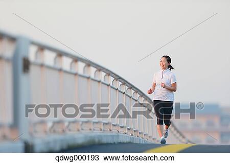 Young Japanese girl jogging View Large Photo Image Stock Image - Young Japanese girl jogging. Fotosearch