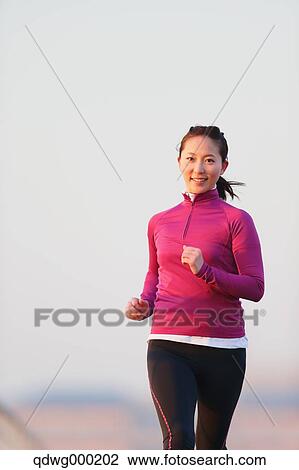Young Japanese girl jogging View Large Photo Image Stock Image - Young Japanese girl jogging. Fotosearch