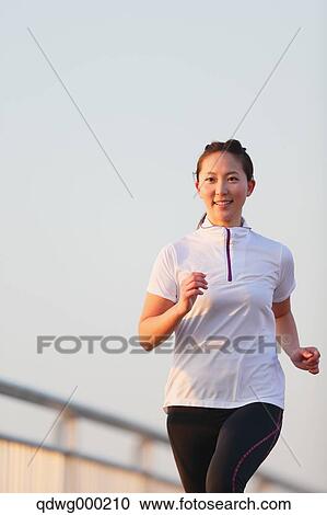 Young Japanese girl jogging View Large Photo Image Stock Image - Young Japanese girl jogging. Fotosearch