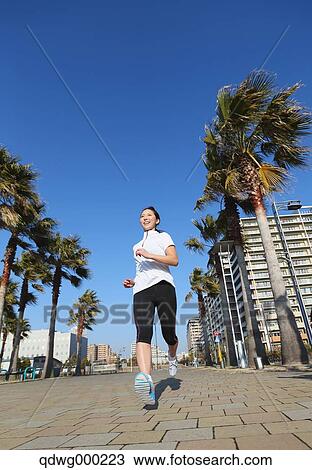 Young Japanese girl jogging View Large Photo Image Stock Image - Young Japanese girl jogging. Fotosearch