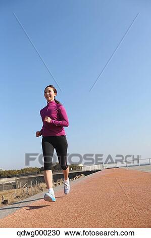 Young Japanese girl jogging View Large Photo Image Stock Image - Young Japanese girl jogging. Fotosearch