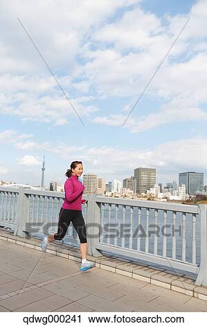 Young Japanese girl jogging View Large Photo Image Stock Image - Young Japanese girl jogging. Fotosearch