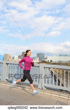 Young Japanese girl jogging View Large Photo Image Stock Image - Young Japanese girl jogging. Fotosearch