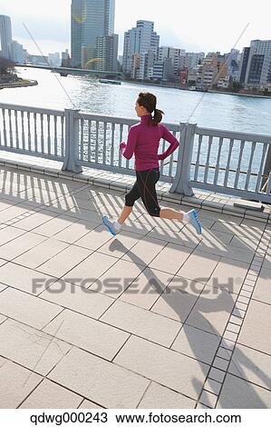 Young Japanese girl jogging View Large Photo Image Stock Image - Young Japanese girl jogging. Fotosearch