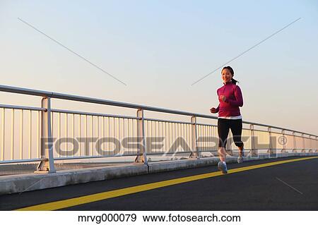 Young Japanese girl jogging View Large Photo Image Stock Photo - Young Japanese girl jogging. Fotosearch