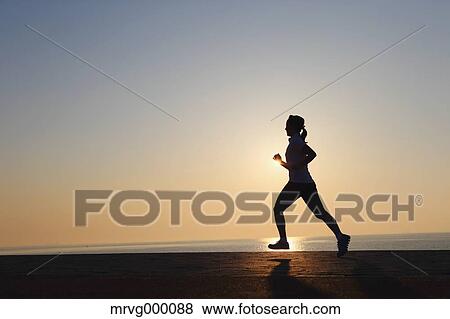 Stock Photo - Young Japanese girl jogging. Fotosearch