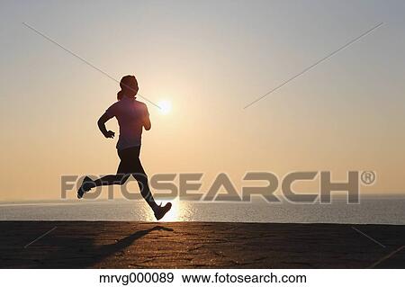 Stock Photo - Young Japanese girl jogging. Fotosearch