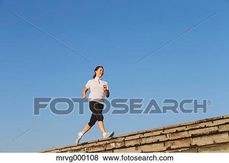 Stock Photo - Young Japanese girl jogging. Fotosearch
