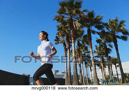 Young Japanese girl jogging View Large Photo Image Stock Photo - Young Japanese girl jogging. Fotosearch