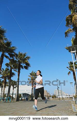 Young Japanese girl jogging View Large Photo Image Stock Photo - Young Japanese girl jogging. Fotosearch