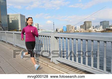 Young Japanese girl jogging View Large Photo Image Stock Photo - Young Japanese girl jogging. Fotosearch