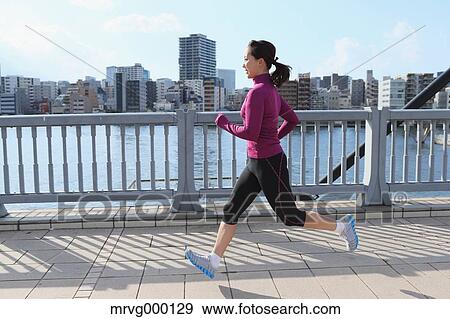 Young Japanese girl jogging View Large Photo Image Stock Photo - Young Japanese girl jogging. Fotosearch