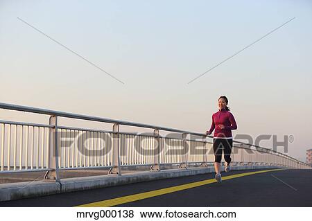 Stock Photo - Young Japanese girl jogging. Fotosearch