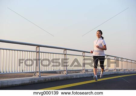 Young Japanese girl jogging View Large Photo Image Stock Photo - Young Japanese girl jogging. Fotosearch