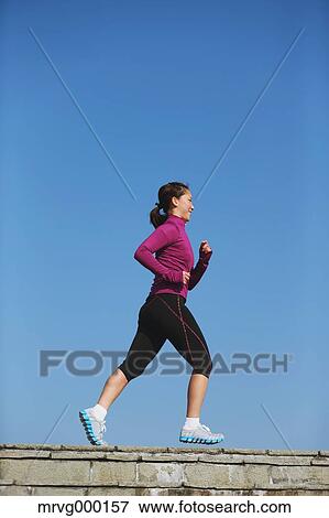 Young Japanese girl jogging View Large Photo Image Stock Photo - Young Japanese girl jogging. Fotosearch