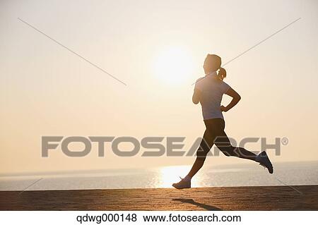 Stock Photo - Young Japanese girl jogging. Fotosearch