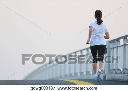 Stock Photo - Young Japanese girl jogging. Fotosearch