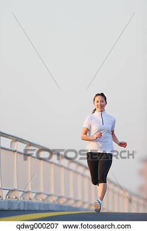 Young Japanese girl jogging View Large Photo Image Stock Photo - Young Japanese girl jogging. Fotosearch