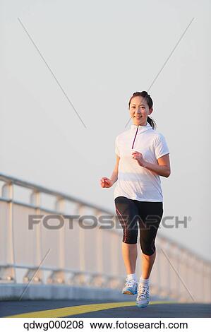 Young Japanese girl jogging View Large Photo Image Stock Photo - Young Japanese girl jogging. Fotosearch