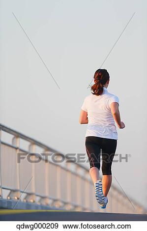 Young Japanese girl jogging View Large Photo Image Stock Photo - Young Japanese girl jogging. Fotosearch