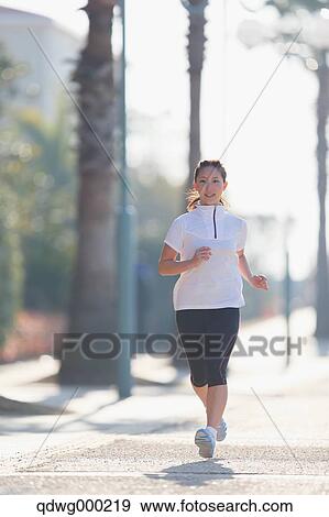 Young Japanese girl jogging View Large Photo Image Stock Photo - Young Japanese girl jogging. Fotosearch