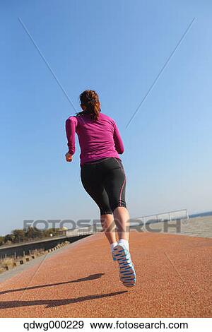 Young Japanese girl jogging View Large Photo Image Stock Photo - Young Japanese girl jogging. Fotosearch