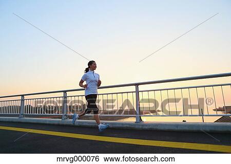 Young Japanese girl jogging View Large Photo Image Stock Photograph - Young Japanese girl jogging. Fotosearch