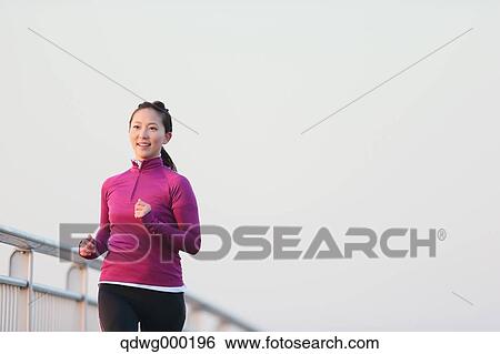 Young Japanese girl jogging View Large Photo Image Stock Photograph - Young Japanese girl jogging. Fotosearch