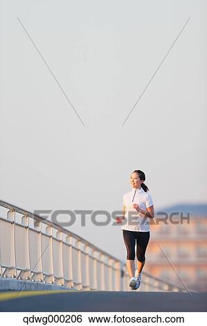 Young Japanese girl jogging View Large Photo Image Stock Photograph - Young Japanese girl jogging. Fotosearch