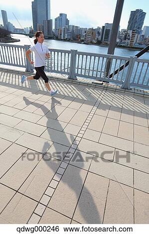 Young Japanese girl jogging View Large Photo Image Stock Photograph - Young Japanese girl jogging. Fotosearch