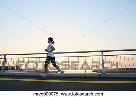 Stock Photography - Young Japanese girl jogging. Fotosearch