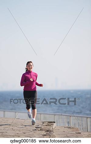 Young Japanese girl jogging View Large Photo Image Stock Photography - Young Japanese girl jogging. Fotosearch