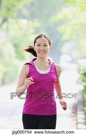 Young Japanese girl running in the park View Large Photo Image Picture - Young Japanese girl running in the park. Fotosearch